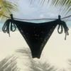 Black Katie tie-side bikini bottom for flattering tanning.